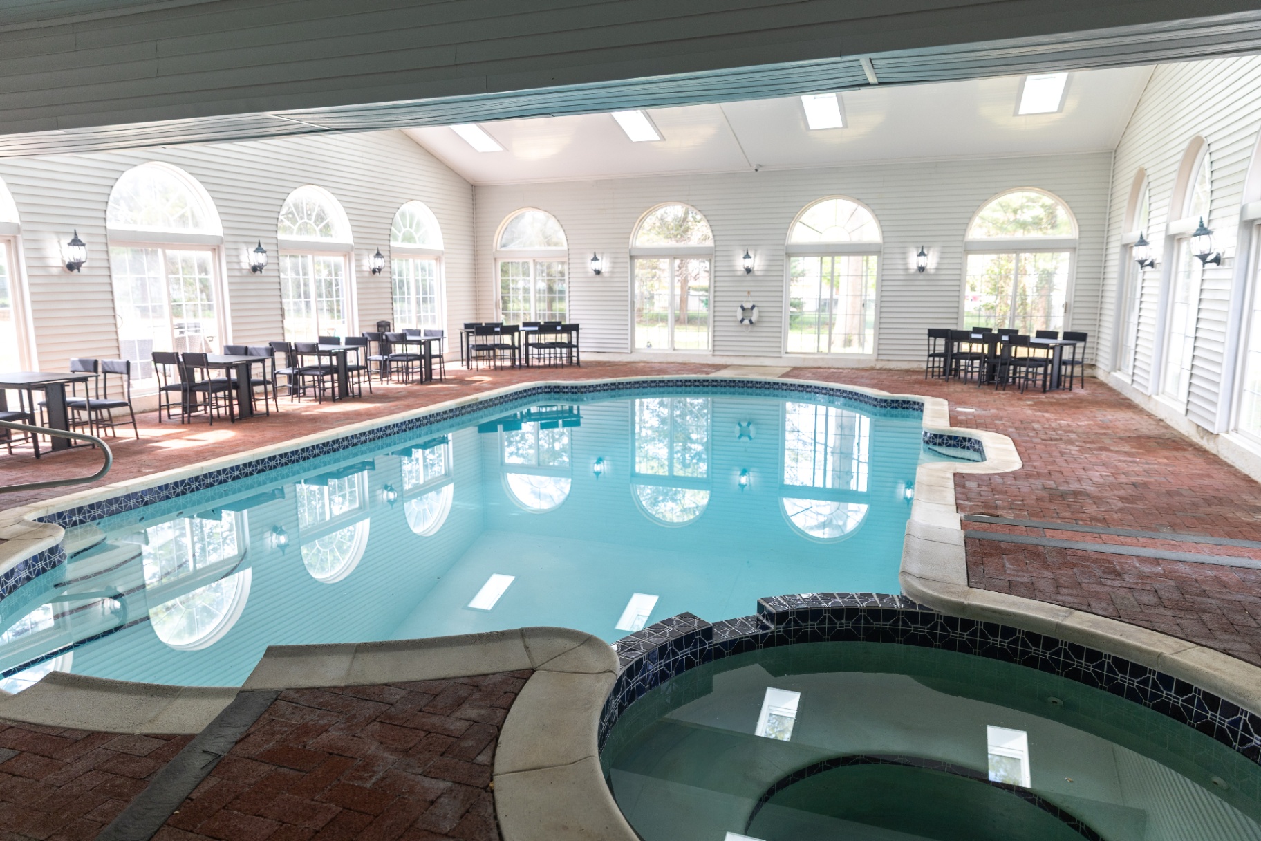 Indoor pool with arched windows
